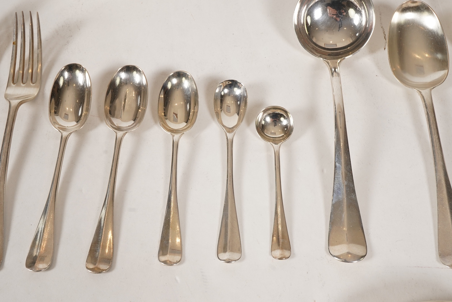A George V canteen of silver Hanoverian rat tail flatware, by Mappin & Webb
